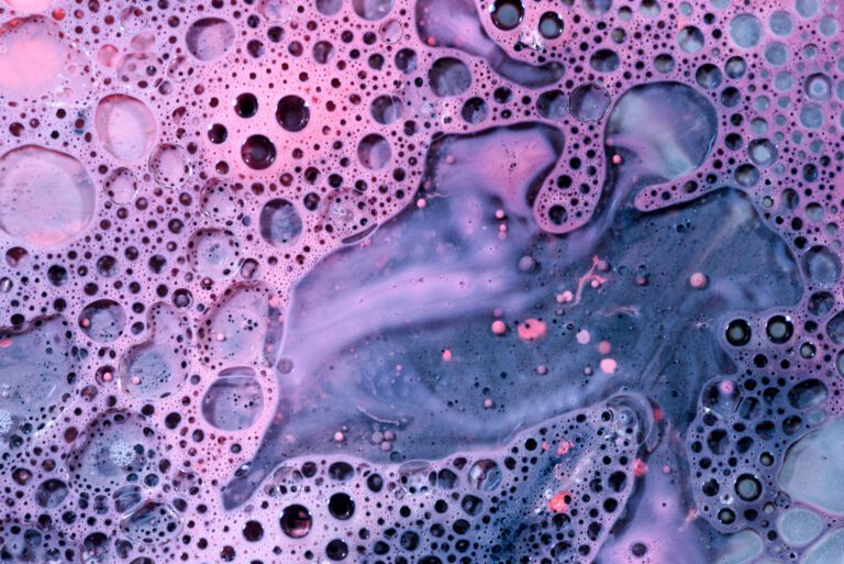 Close up of a pink and blue bubbly liquid